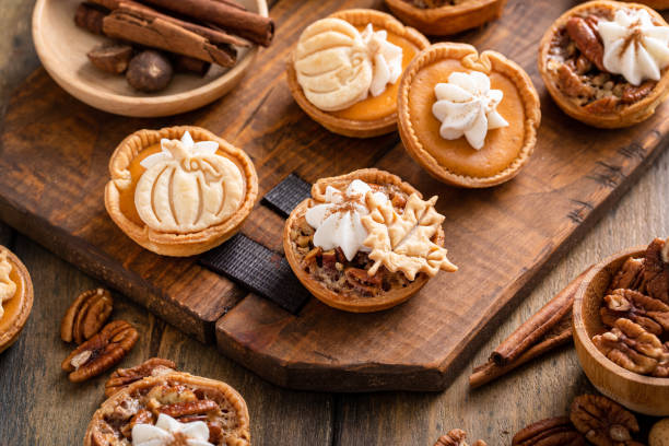 istock Mini pumpkin and pecan pies baked in muffin tin 1443992007