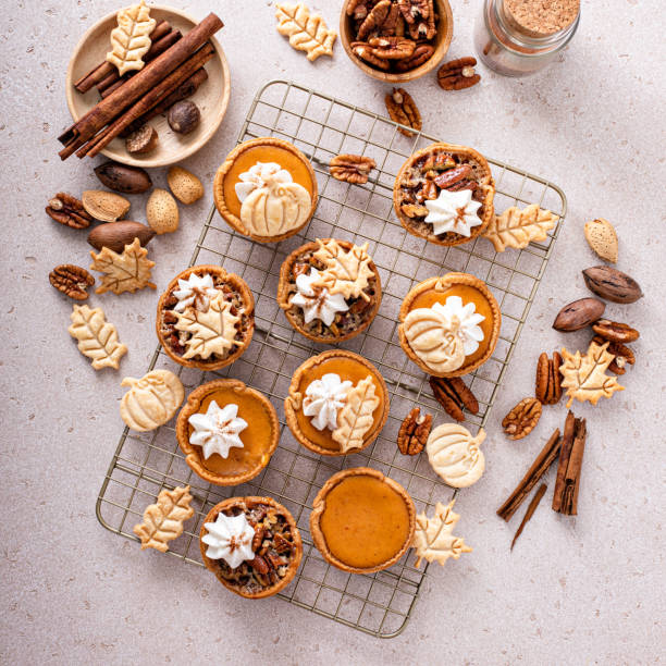 istock Mini pumpkin and pecan pies baked in muffin tin 1443993013