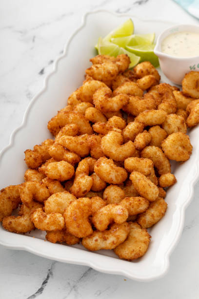 istock Coconut popcorn shrimp, appetizer idea with a dipping sauce 1443993422