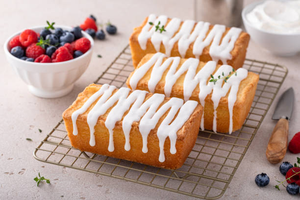 istock Classic pound cake with powdered sugar glaze dripping over 1443993453