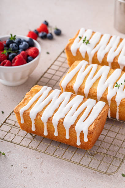 istock Classic pound cake with powdered sugar glaze dripping over 1443993463