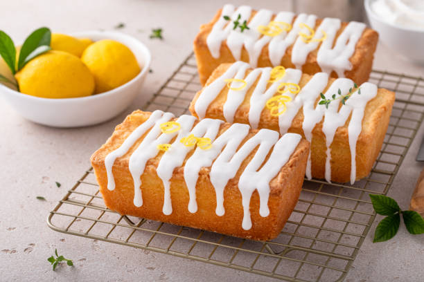 istock Classic lemon pound cake with powdered sugar glaze dripping over 1443993470