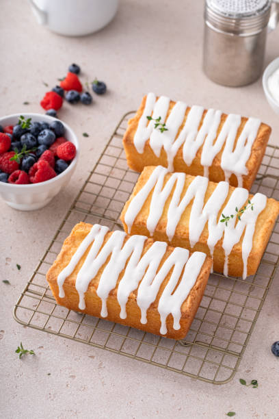 istock Classic pound cake with powdered sugar glaze dripping over 1443993472