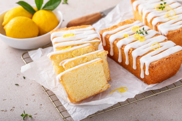 Classic lemon pound cake with powdered sugar glaze dripping over