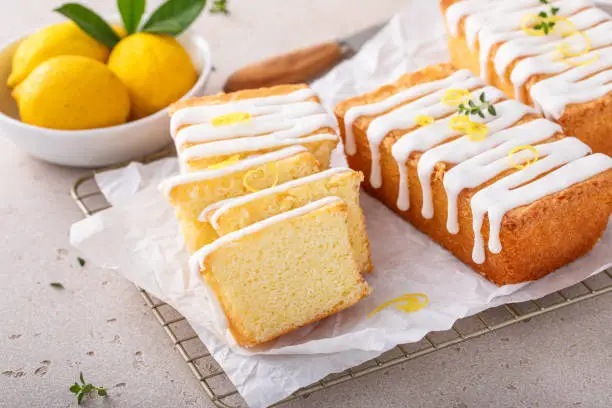 Photo of Classic lemon pound cake with powdered sugar glaze dripping over