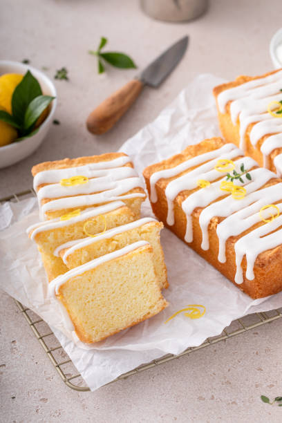 istock Classic lemon pound cake with powdered sugar glaze dripping over 1443993479