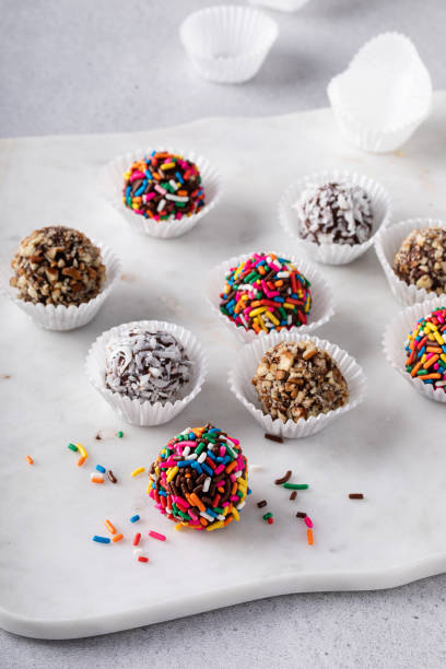 istock Homemade chocolate truffles covered with sprinkles and nuts 1443993540