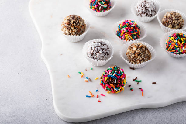 istock Homemade chocolate truffles covered with sprinkles and nuts 1443993547