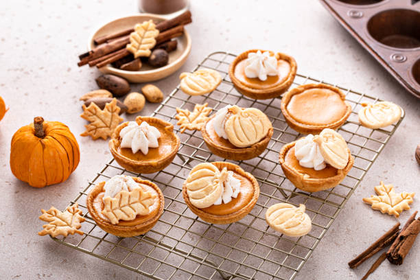 istock Mini pumpkin pies with wipped cream and cinnamon 1443993839