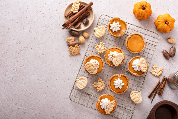 istock Mini pumpkin pies with wipped cream and cinnamon 1443993845