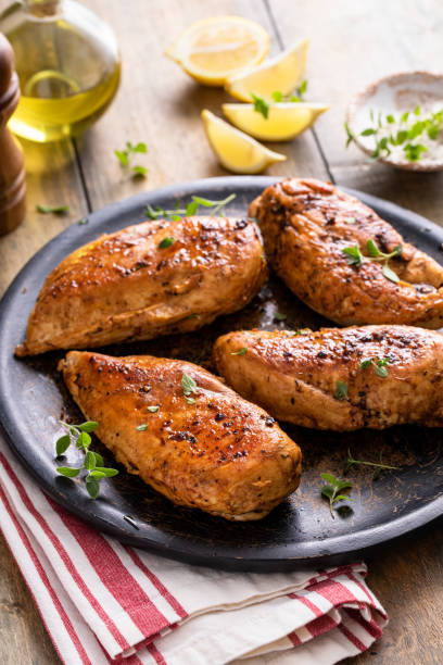 istock Roasted or seared chicken breast with herbs 1443993857
