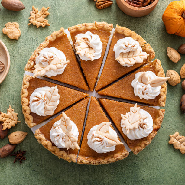 istock Traditional Thanksgiving pumpkin pie cut into slices 1443993913
