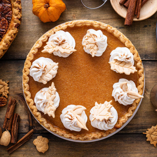 istock Traditional Thanksgiving pumpkin pie topped with whipped cream 1443993914