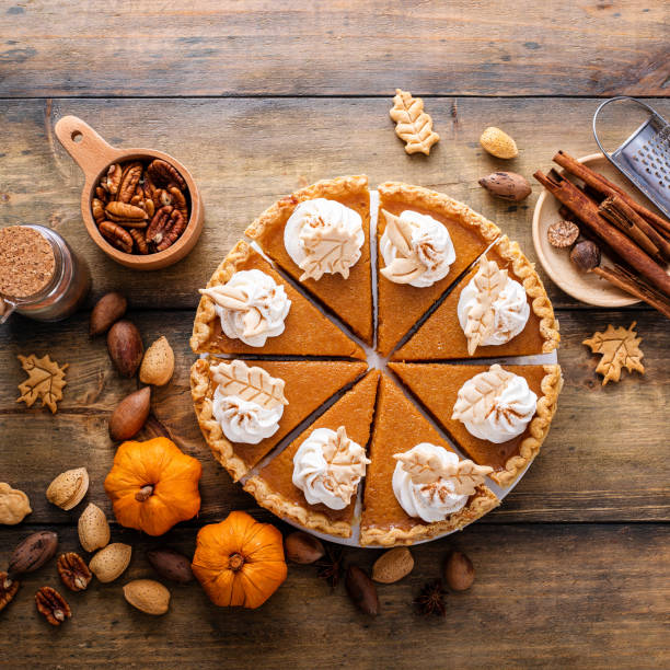 istock Traditional Thanksgiving pumpkin pie cut into slices 1443993919