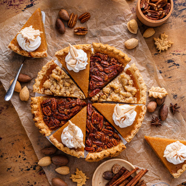 istock Traditional fall Thanksgiving pie slices, pumpkin and pecan pie 1443993924