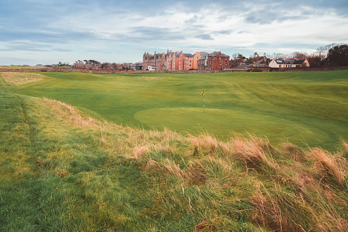 North Berwick, UK - December 28 2019: Scenic fairway and putting green at the historic 17th century old West Links at North Berwick Golf Course, Scotland.