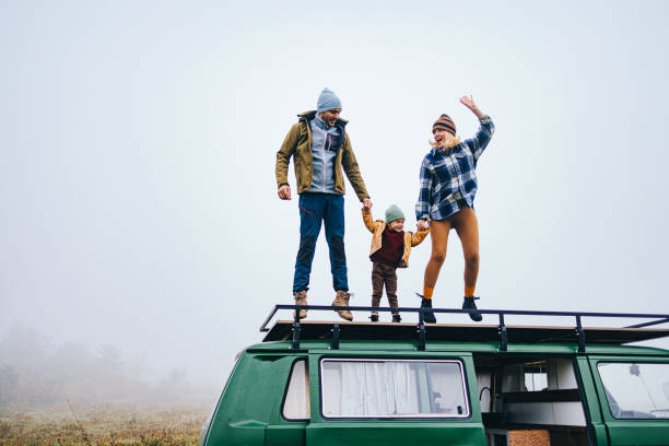 istock Happy Family Holding Hands And Jumping On A Van 1443997949