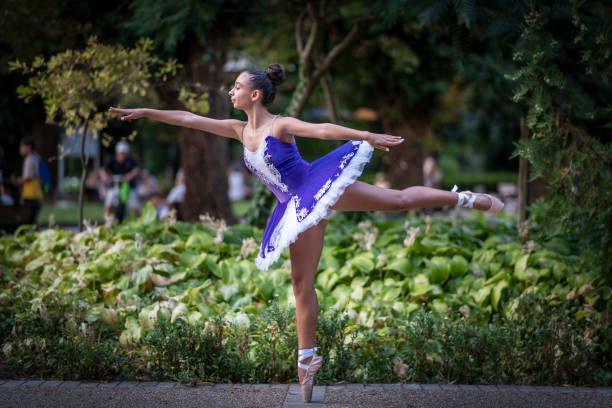 istock Ballet dancer posing in the city park. 1444003987