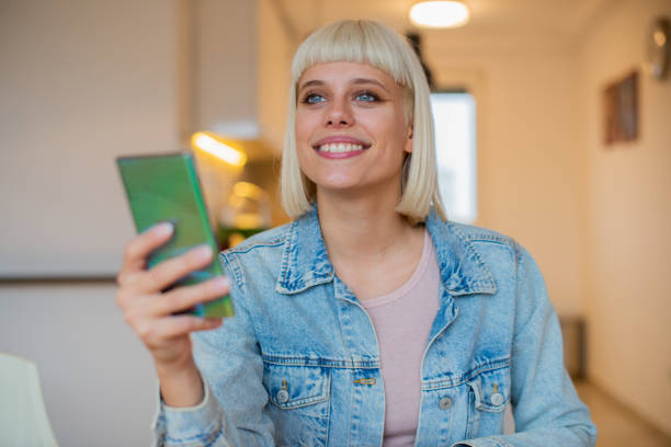 istock Portrait of a young woman using smartphone 1444005013