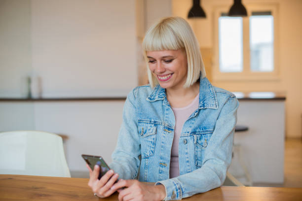 istock Portrait of a young woman using smartphone 1444005018