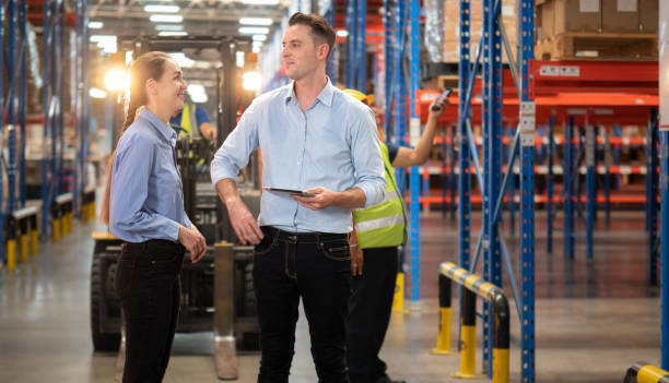 istock Distribution warehouse manager and client businesswoman using digital tablet checking inventory storage on shelf. 1444015874
