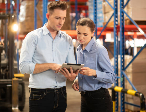 istock Distribution warehouse manager and client businesswoman using digital tablet checking inventory storage on shelf. 1444015908