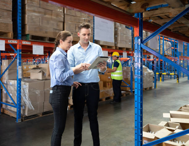 istock Storehouse supervisor worker and logistic engineer standing together at storage room. 1444017008