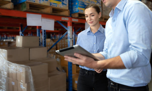 istock Storehouse supervisor worker and logistic engineer standing together at storage room. 1444017883
