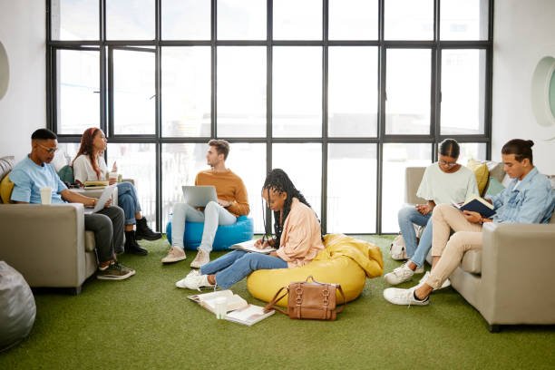 istock Education, studying and students meeting for project collaboration, teamwork or research planning in university workspace. Design, creativity and relax gen z group of people in college study team 1444021561