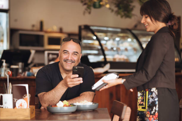 istock Mobile payment with NFC technology on smartphone. 1444027453