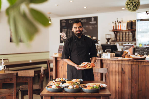istock Waiter ready to serve food in cafe. 1444027933