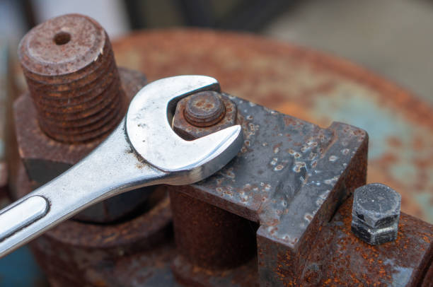 spanner for tightening bolts in old rusty iron rods, wrenches, bolts, screws and nuts. - bolt nut screw hardware store imagens e fotografias de stock