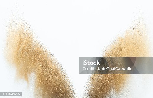 istock Sand flying explosion, Golden sand wave explode. Abstract sands cloud fly. Yellow colored sand splash throwing in Air. White background Isolated high speed shutter, throwing freeze stop motion 1444034709