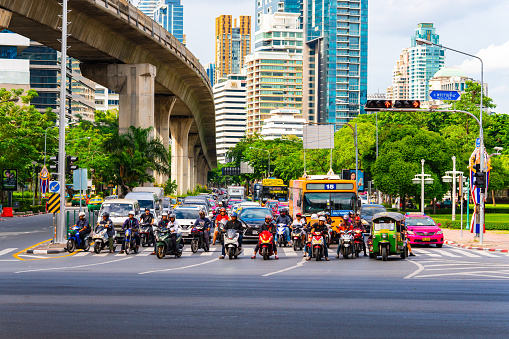 Bangkok, Thailand - June 22, 2019 :  Traffic moment in afternoon on Silom junction at downtown of Bangkok, Thailand