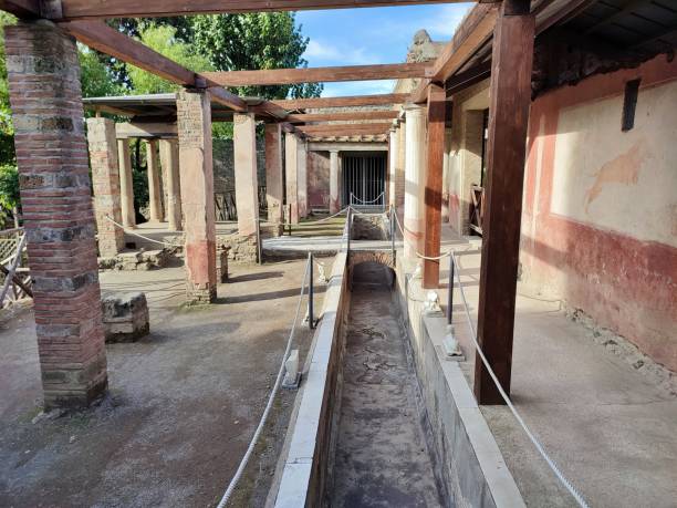 Pompeii - Canal of the nymphaeum of the House of Ottavio Quartione Pompeii, Campania, Italy - October 14, 2021: House of Ottavio Quartione between Via di Castricio and Via dell'Abbondanza in the Archaeological Park of Pompeii fountain courtyard villa italian culture stock pictures, royalty-free photos & images