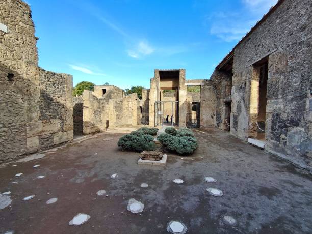 Pompeii - Entrance courtyard of the House of Ottavio Quartione Pompeii, Campania, Italy - October 14, 2021: House of Ottavio Quartione between Via di Castricio and Via dell'Abbondanza in the Archaeological Park of Pompeii fountain courtyard villa italian culture stock pictures, royalty-free photos & images