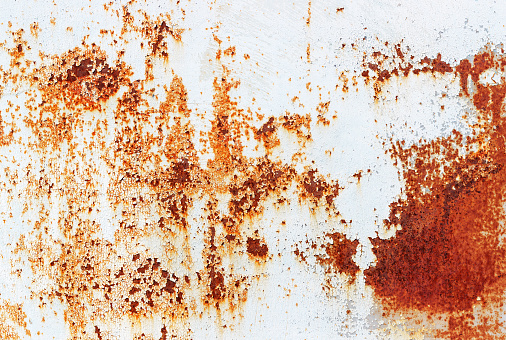 Close-up of painted metal plate with rust on a shipyard. With copy space. Shot with a 35-mm full-frame 61MP Sony A7R IV.