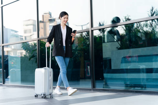 Asian businesswoman portrait at the airport Asian businesswoman portrait at the airport air transport building stock pictures, royalty-free photos & images