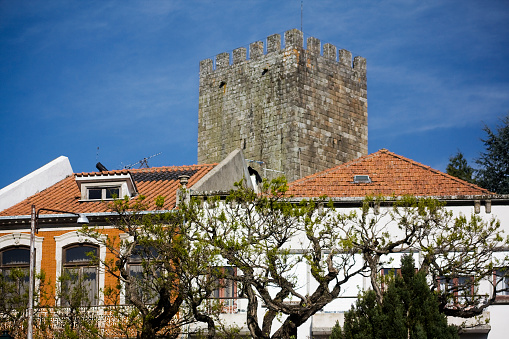 Lamego cityscape , Viseu district, Portugal.  Castle keep in the background, street view, pedestrian zone.