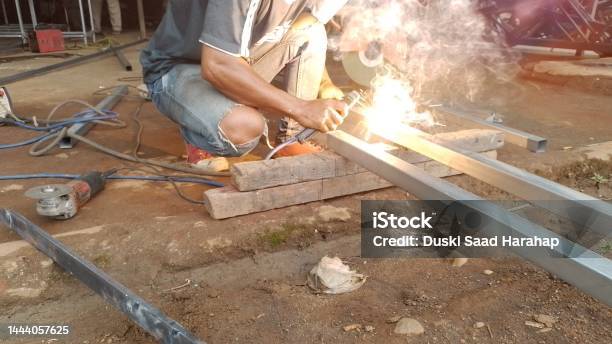 Sparks Of Steel Welder Work At Factory Stock Photo - Download Image Now - Adult, Adults Only, Blue