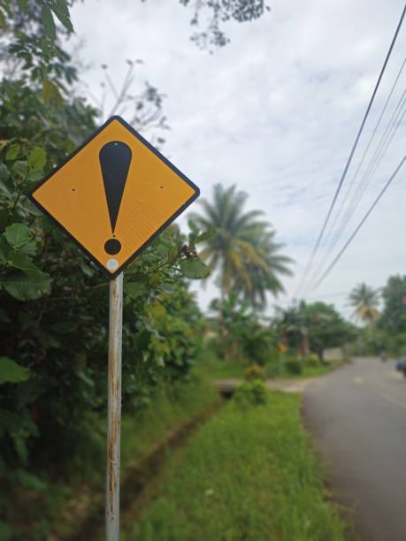 Road warning sign photographed at morning on the Kijang city road Indonesia Carefull road sign which photographed at morning in kijang city road Indonesia kijang stock pictures, royalty-free photos & images