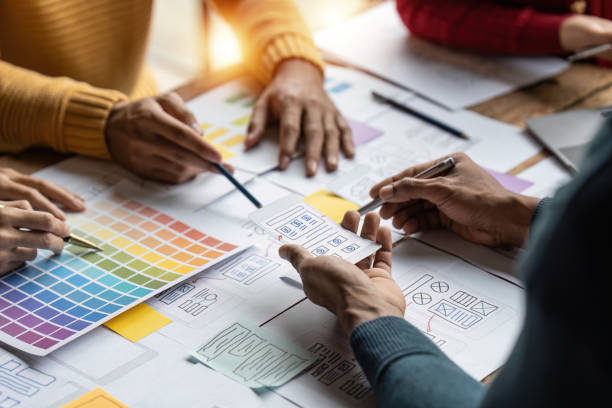 istock Group of ux developer and ui designer brainstorming about app interface design at modern office. Creative digital development agency 1444064180