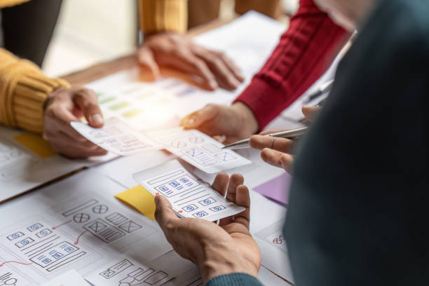 istock Group of ux developer and ui designer brainstorming about app interface design at modern office. Creative digital development agency 1444064378