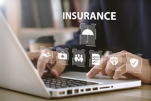 online insurance Businessmen use computers to make insurance online. For travel, cars, finance, health, life and family. insurance concept
