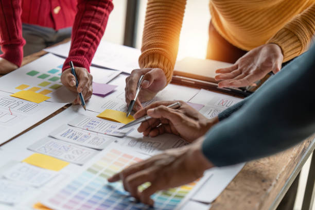 istock Group of ux developer and ui designer brainstorming about app interface design at modern office. Creative digital development agency 1444064906