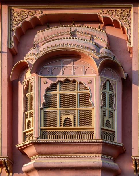 Closeup of one of the windows from the Hawa Mahal palace in Jaipur, India A closeup of one of the windows from the Hawa Mahal palace in Jaipur, India mahal stock pictures, royalty-free photos & images