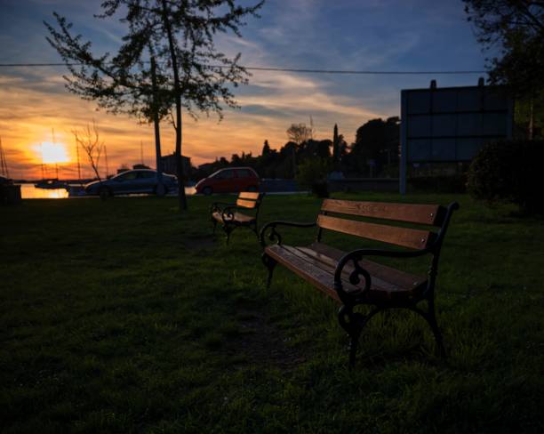 istock Dramatic sunset with selective focus shot on a bench, Zadar, Croatia 1444065891