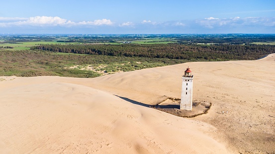 The iconic lighthouse Rubjerg Knude Fyr on a sand dune in norther Denmark near Hirtshals