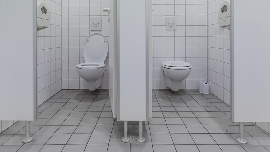 Two separated toilets at a public restroom