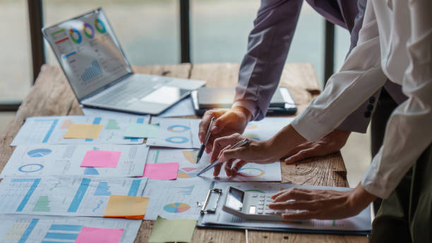 istock Business people brainstorming data target financial on financial document paperwork. business finance and discuss concept 1444069374